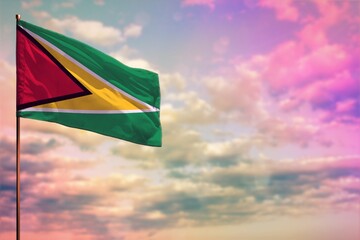 Fluttering Guyana flag mockup with the space for your content on colorful cloudy sky background.