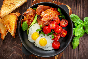 Traditional american breakfast with bacon and eggs