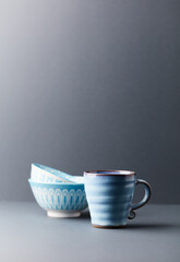 Traditional, handcrafted ceramic on gray background. Soft focus. Copy space.	