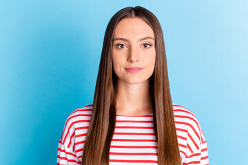 Photo of adorable shiny young girl wear striped shirt smiling isolated blue color background