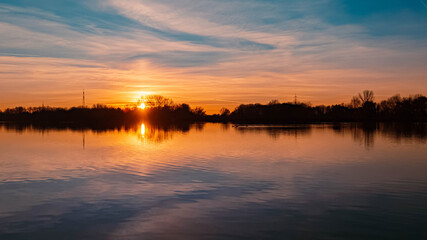 Beautiful sunset with reflections near Plattling, Isar, Bavaria, Germany