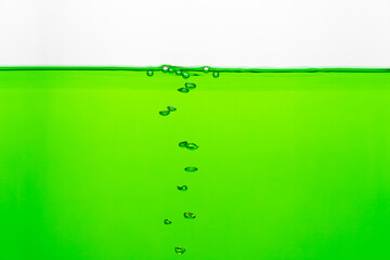 Close up to row of  air bubble , green water on white background.