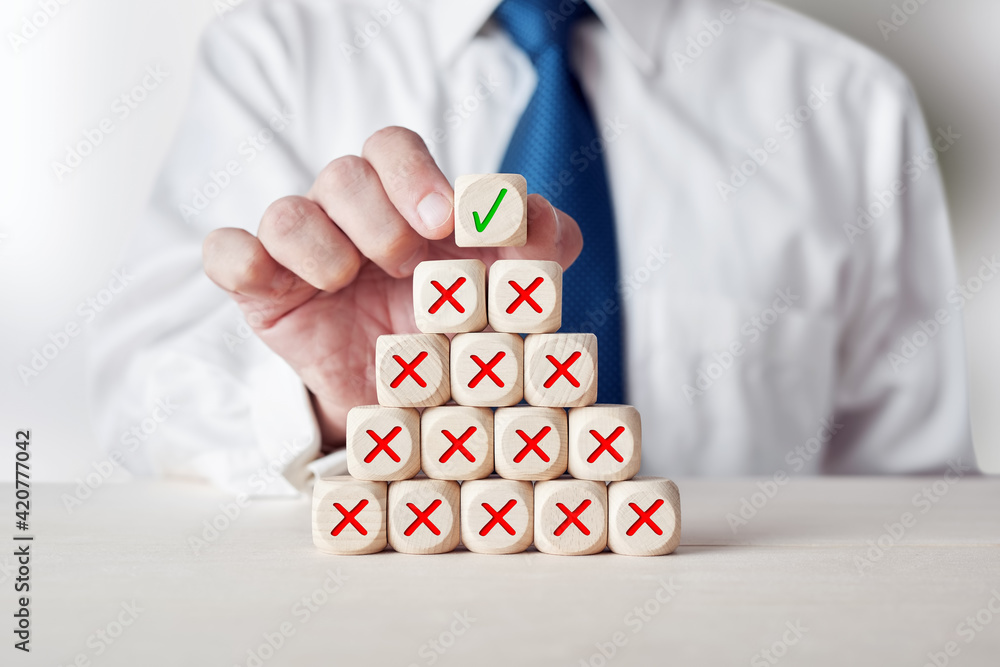 Poster businessman places the cube with the check mark symbol on top of a wooden cube stack with wrong or c