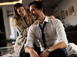 Young man having a problem. Girlfriend comforting her sad boyfriend..