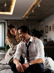 Young man having a problem. Girlfriend comforting her sad boyfriend..