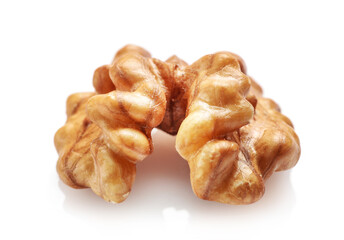 Single golden walnut kernel isolated on white