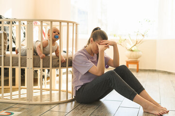 The mother is very tired, and the child does not want to fall asleep. Mom's trying to take a nap....