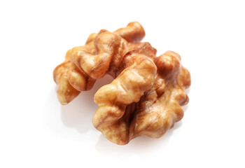 Single golden walnut kernel isolated on white