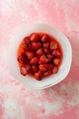 A bowl full of chopped strawberry