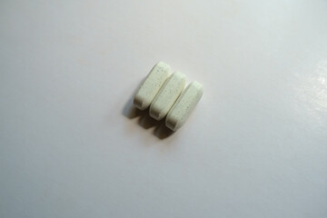 Dull green caplets of kelp dietary supplement (three items)