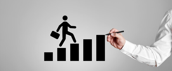 Businessman draws a stickman climbing steps of career. Career planning, achievement and success in business.