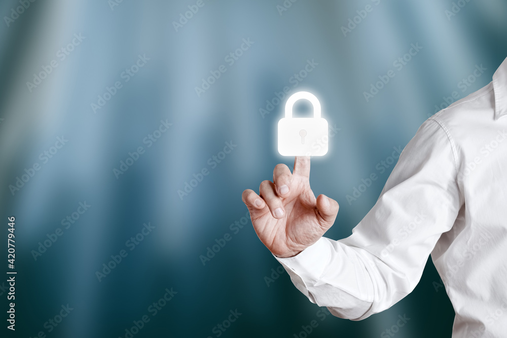 Poster businessman pressing a lock or padlock icon on a virtual display screen. internet or cyber security