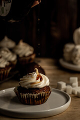 Cupcake on a dessert table background. The cupcake in focus.