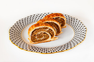 Traditional Hungarian walnut rolls on an elegant Herend porcelain plate.