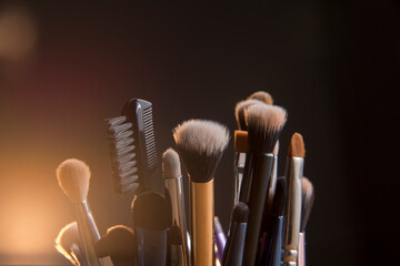 Close up photo of Makeup brushes with Bokeh