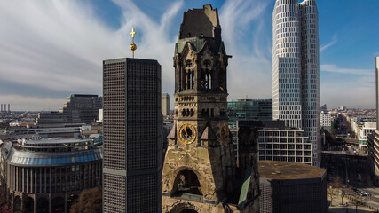Famous Kaiser Wilhelm Memorial Church in Berlin - urban photography - obrazy, fototapety, plakaty
