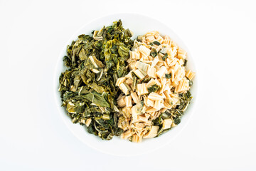 Chopped dried cabbage on a dish on white background