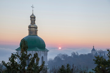 Kiev Pechersk Lavra monastery in Kiev, Ukraine. Orthodox church in the morning fog at dawn