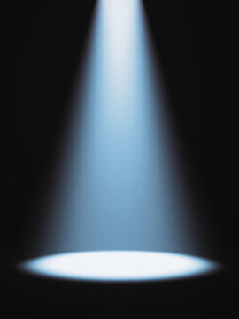 Defocused view on empty studio background lit from top by round spotlight. Visible light cone. Place for displaying product.