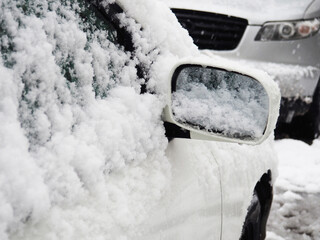 Winter season, car and glass in ice, under snow, freezing rain