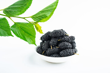 Mulberry leaf and mulberry fruit on white background
