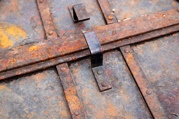 steampunk composition with metal bars and rusty industrial objects - closeup view of the colorful textures