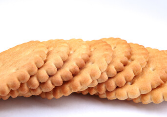 a row of round crackers on a white background.