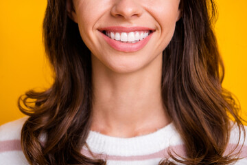 Cropped photo of young girl brown hair happy smile white perfect teeth oral care stomatology isolated over yellow color background