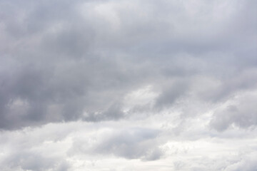 Grey sky with fluffy clouds, abstract background