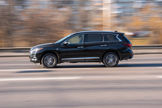 Ukraine, Kyiv - 11 March 2021: Black Infiniti QX60 Car Moving On The Street;