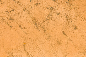 Light orange or brown wall texture with dark abstract background pattern