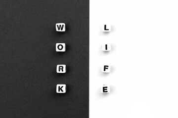 Work and life. Cubes on black white background. Concept of balance, harmony, no stress. Choice