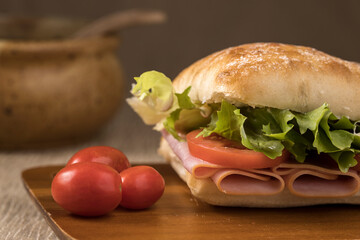 Close up of ham sandwich on a roll.