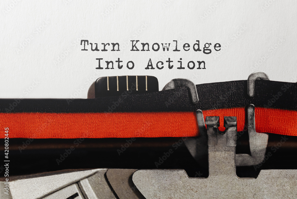 Poster text turn knowledge into action typed on retro typewriter