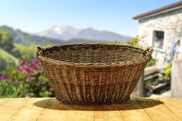 Empty wooden basket and summer landscape 