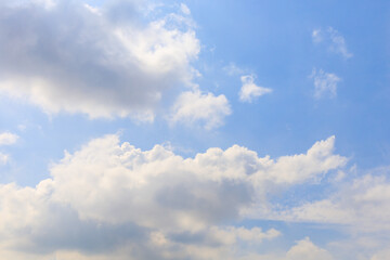 White clouds on the blue sky for background.
