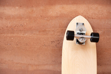 Surf skate board on wall background