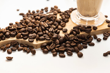 Cappuccino and coffee beans on a white background.