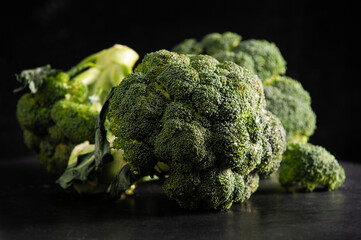 fresh green broccoli on dark background