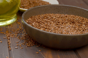 Flax seeds on a wooden background. flax seed oil healthy food concept