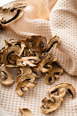 dried chopped mushrooms champignons, scattered on the table, blank, semi-finished product, additive for cooking