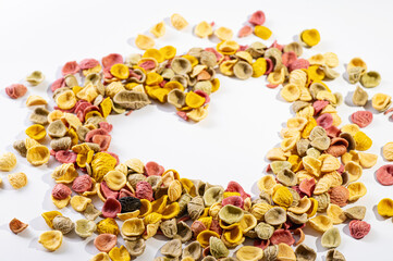 handmade pasta on a white background, love heart symbol, empty space, place for text