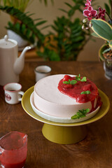strawberries mousse with strawberries sauce. Wood background. Side View. Selective focus, close-up. Strawberries, mint,  coffee and home flowers. 