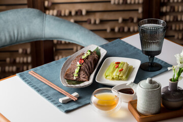 Chinese mongolian beef with spices and celery asian style on the table at restaurant