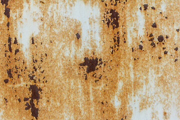 Rusty metal background.The texture of old rusty metal.Spots and streaks of rust on the light metal surface.