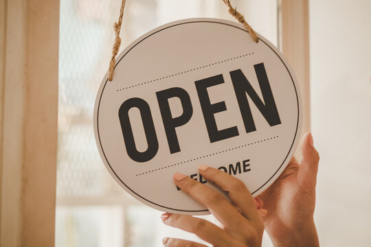 Hand Of Young Asian Business Owner, Employee Retail,coffee Shop Woman,girl Turning,setting Sign Board To Open For Welcome Customer, Reopen Store After Close Lockdown Quarantine In Covid.Label Concept.