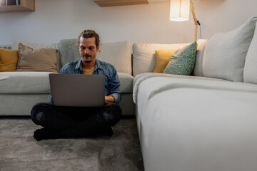 Young man working on the laptop