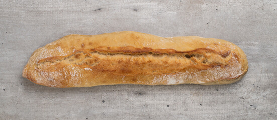 Traditional homemade french baguette bread over wooden table