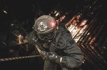 Special forces fighter descends from a skyscraper to storm the apartment. SWAT, police, counter...