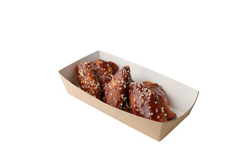 appetizing fried portion of chicken BBQ in paper box on white isolated background